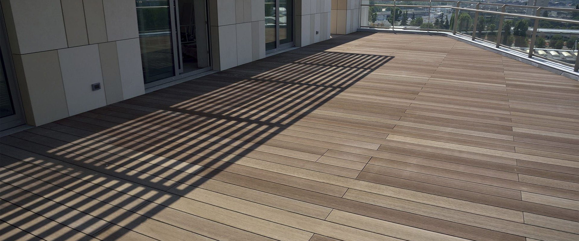 Worker applying balcony coating with roller